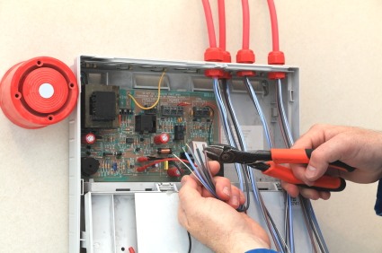 PTI Electric, Plumbing, & HVAC installing alarm system in Galloway, OH